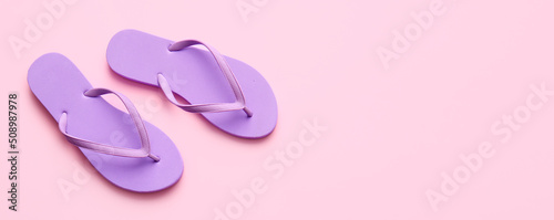 Stylish flip-flops on pink background with space for text