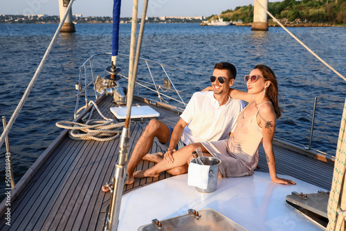 Happy young couple resting on yacht © Pixel-Shot