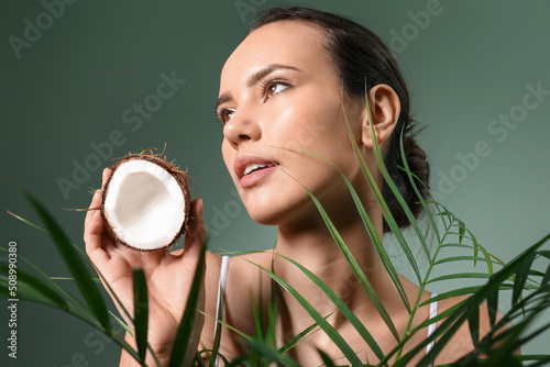 Young woman with coconut an...