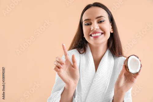 Young woman with coconut an...