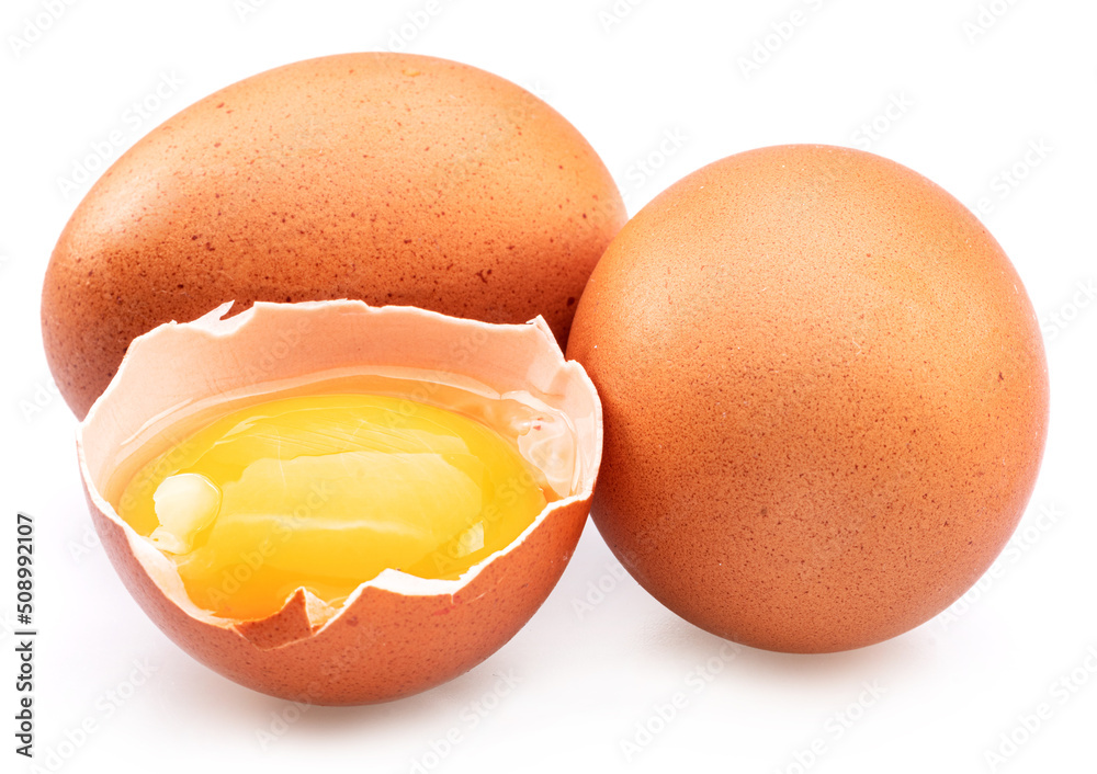Brown chicken eggs and egg yolk isolated on white background. Brown chicken eggs and egg yolk isolated on white background.