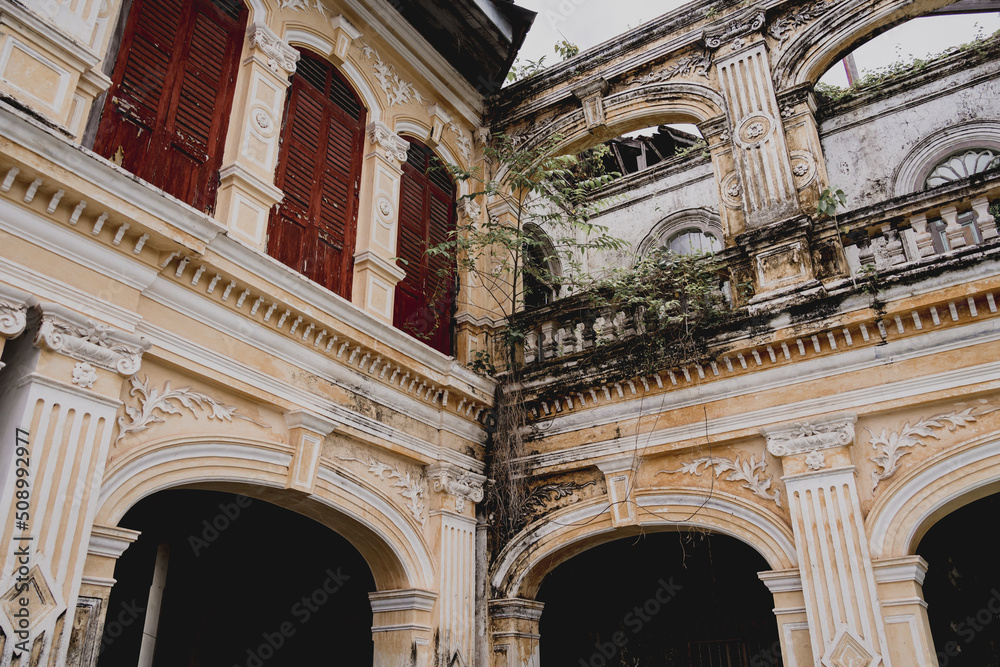 Colorful old house facades and ornate metal balconies