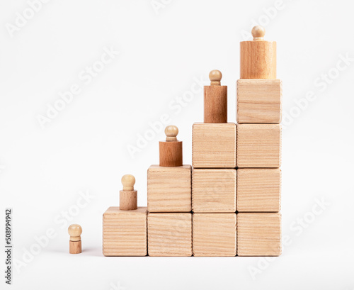 Career ladder from cubes with knobbed cylinders. Growth, personal and professional development or hierarchy concept. Promotion in company. High quality photo photo