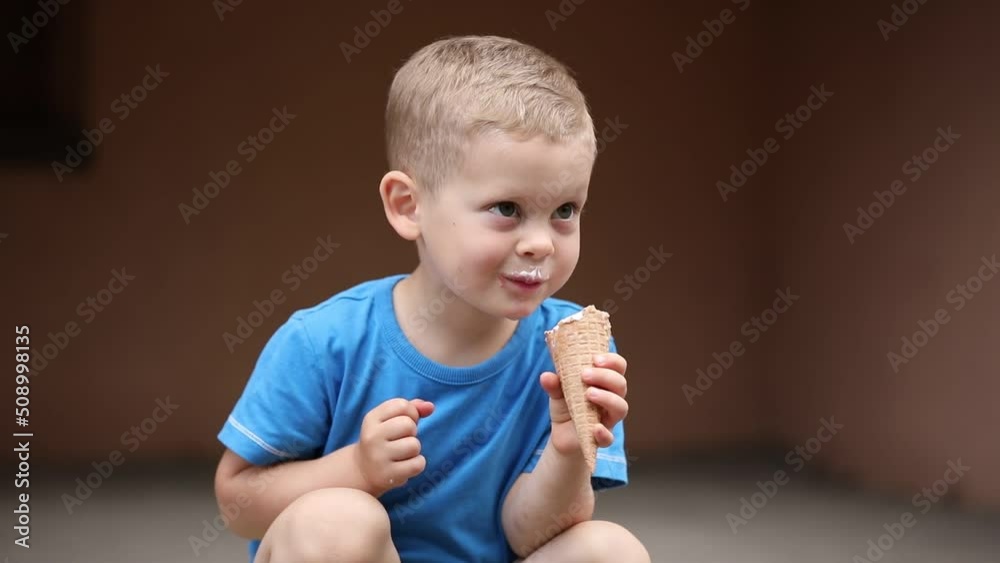 little boy eating ice cream on the street
little boy eating ice cream on the street