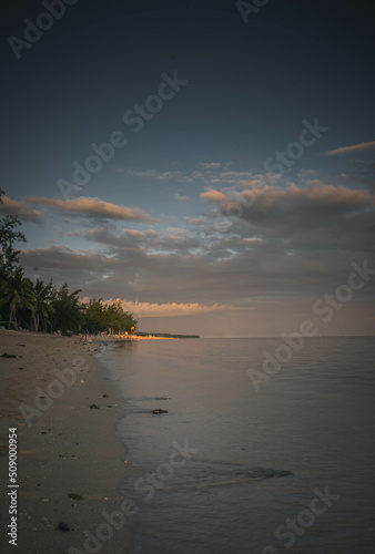 Fototapeta Naklejka Na Ścianę i Meble -  Sand beach in Indian Ocean during the sunset, Mauritius
