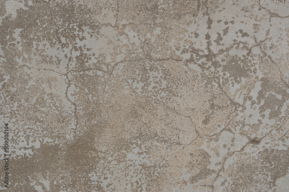 Old wall texture with two layers of peeling paint. Surface of an old cracked worn wall with layers of beige and white peeling paint. Old wall texture with two layers of peeling paint. Surface of an old cracked worn wall with layers of beige and white peeling paint.