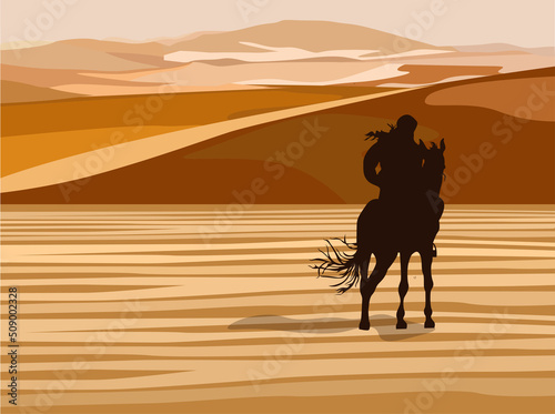 Silhouette of a rider on a horse in the dunes of the desert.