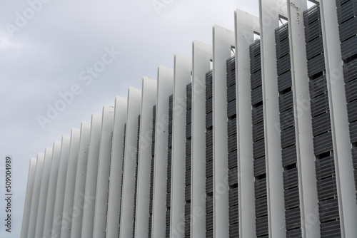 building architecture with vertical lines with cloudy sky on spring day