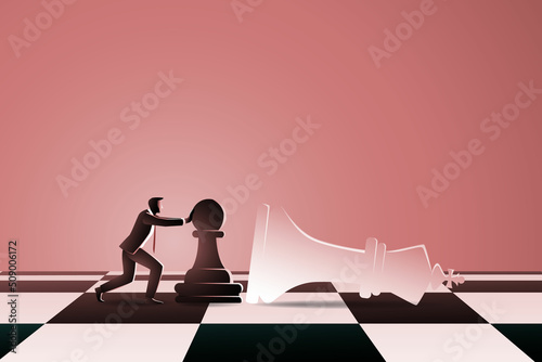 Fotografiet businessman on chess board pushing chess pawn to fall down white king chess