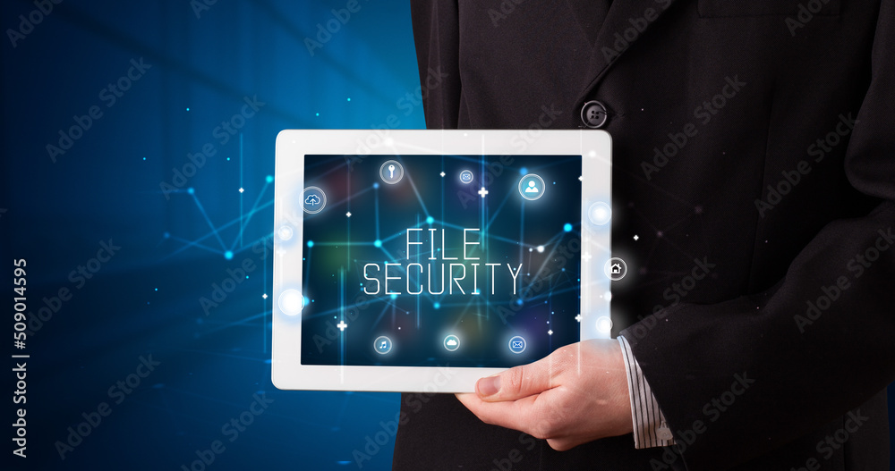 Person holding tablet, security concept Person holding tablet, security concept
