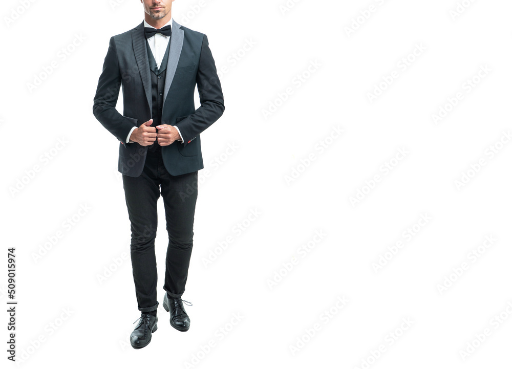 formal man in tuxedo bowtie isolated on white background. full length formal man in tuxedo bowtie isolated on white background. full length