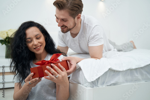 Man in love giving present to female companion