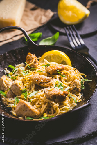 Lemon Chicken Pasta in cast iron pan with basil and Parmesan