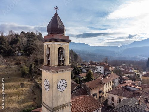 Aerial view of the bell tower of the Ippolito and Cassiano church in Cassano Valcuvia, province of Varese, Lombardy, Italy photo