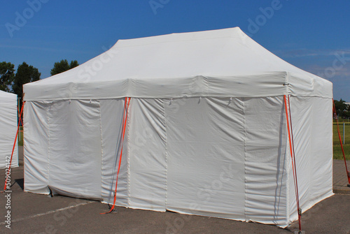 white tent pitched to accommodate refugees from countries