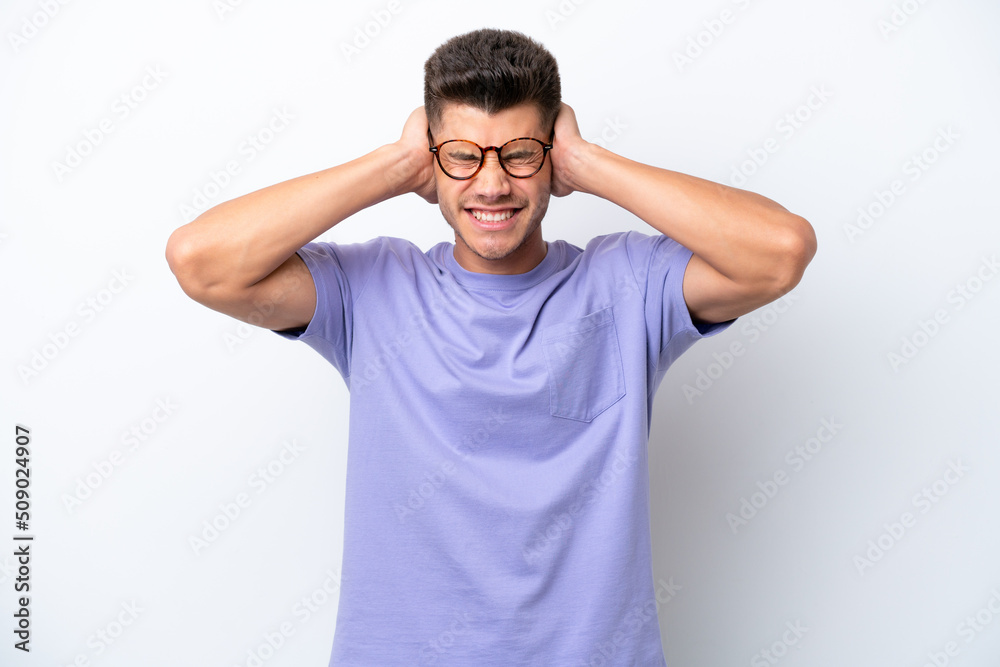 Young caucasian man isolated on white background frustrated and covering ears Young caucasian man isolated on white background frustrated and covering ears