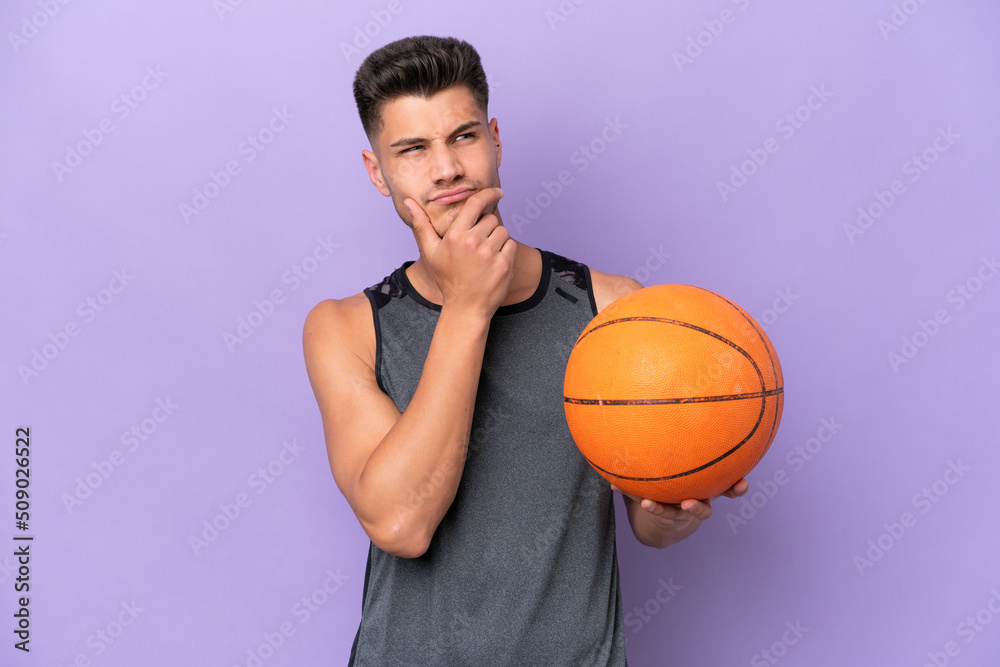 young caucasian woman  basketball player man isolated on purple background having doubts