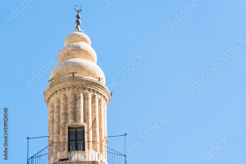 Ulu Mosque minaret in Mardin Turkey. Historic landmarks of Mardin Turkey. Old mosque minaret and sky copy space for text