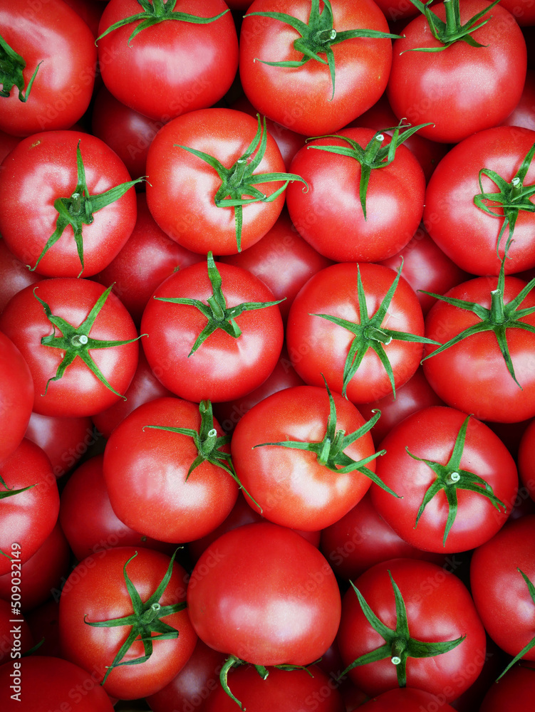 Raspberry tomatoes photographed at the market on a sunny spring day. Tasty and sweet vegetables rich in vitamins. Close up. Organic food from Poland. Raspberry tomatoes photographed at the market on a sunny spring day. Tasty and sweet vegetables rich in vitamins. Close up. Organic food from Poland.