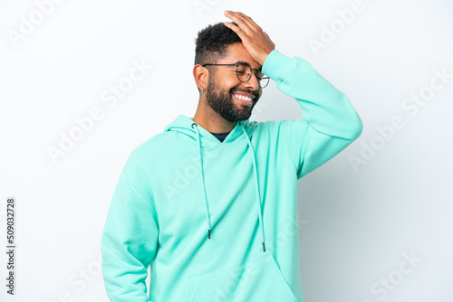 Young Brazilian man isolated on white background has realized something and intending the solution © luismolinero