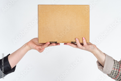 Box in hand. Women hands wi...