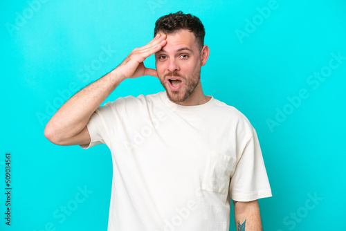 Young Brazilian man isolated on blue background has realized something and intending the solution