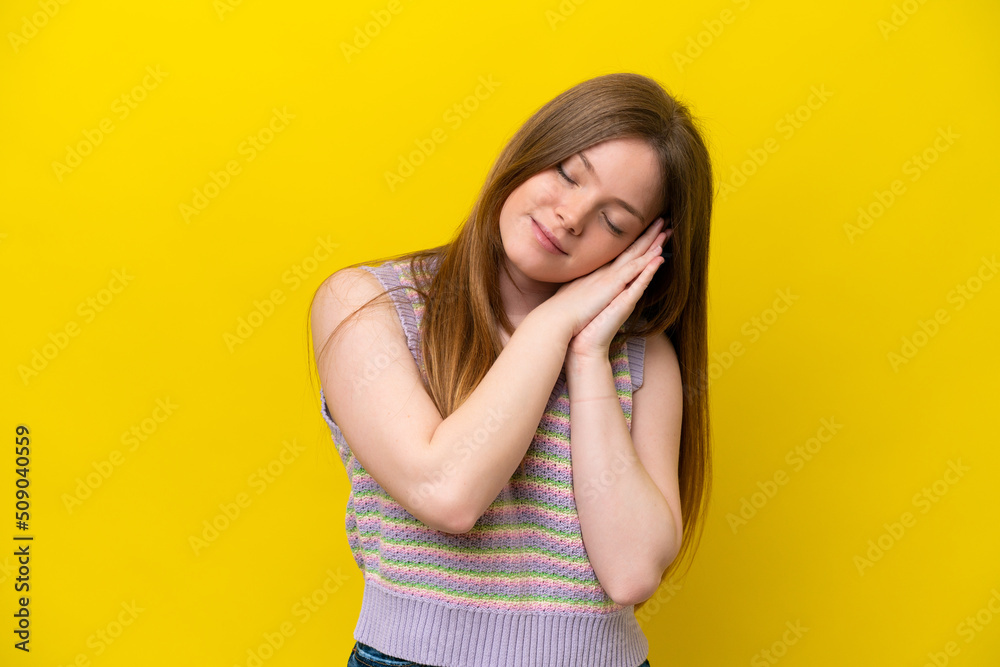 Young caucasian woman isolated on yellow background making sleep gesture in dorable expression Young caucasian woman isolated on yellow background making sleep gesture in dorable expression
