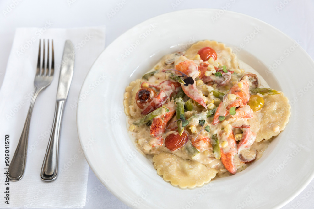 lobster ravioli with tomatoes and cream sauce