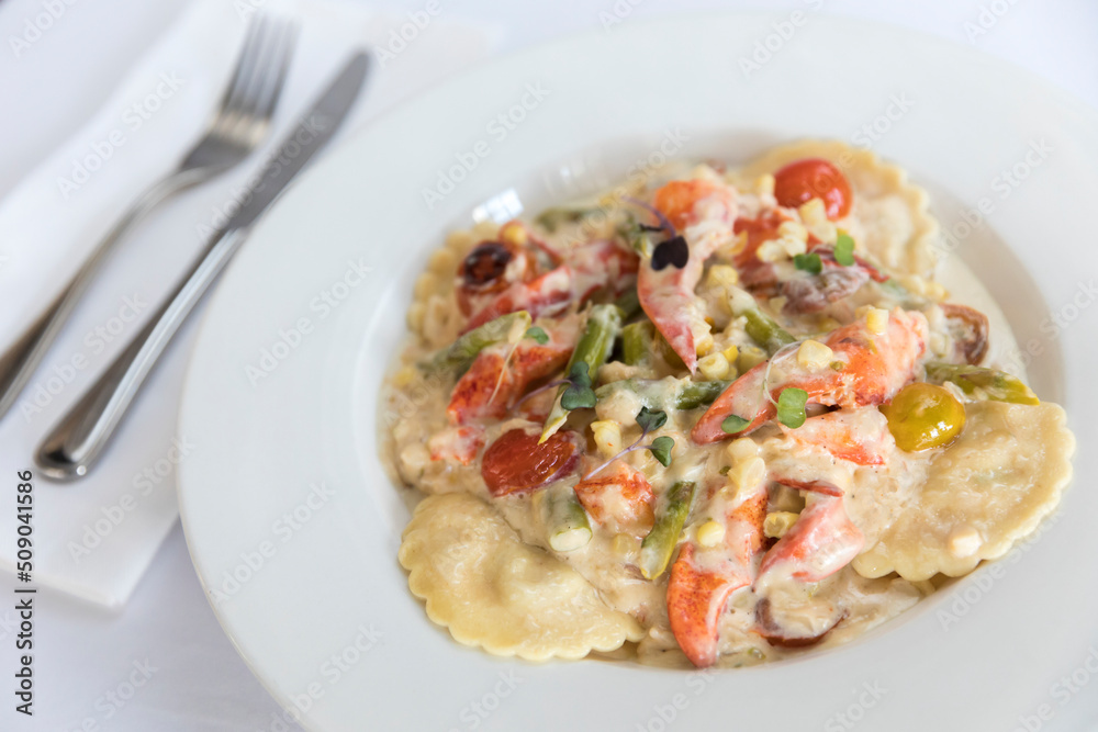 lobster ravioli with tomatoes and cream sauce