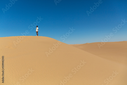 Black Woman on a sand dune photo