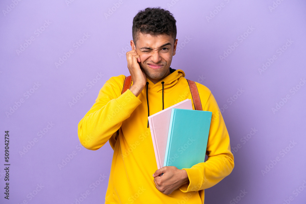 Young student Brazilian man isolated on purple background frustrated and covering ears Young student Brazilian man isolated on purple background frustrated and covering ears