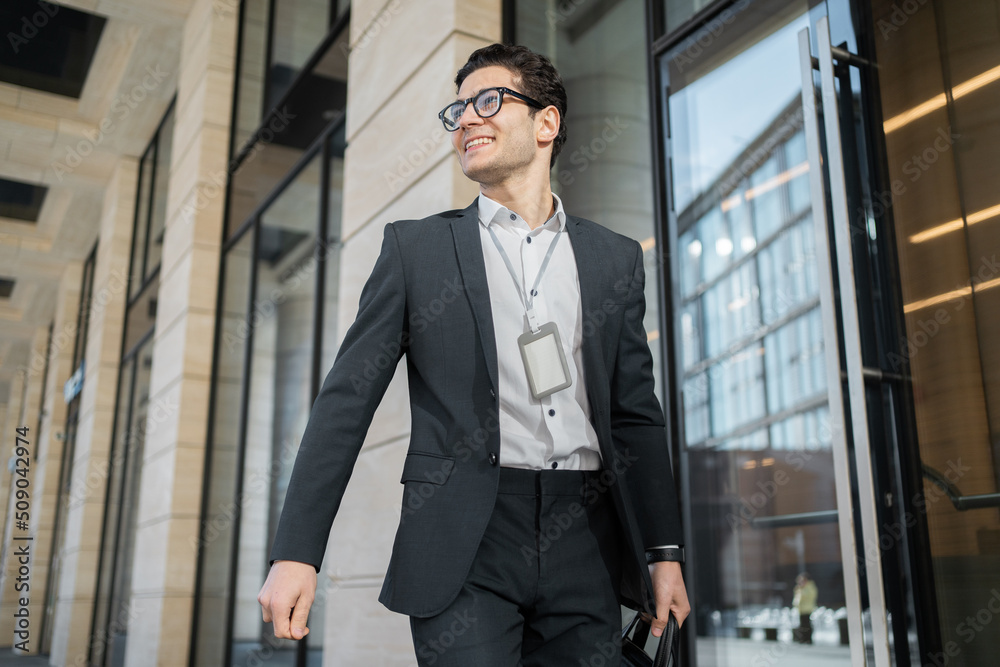A successful man with glasses goes to work in a coworking space startup of a new project A successful man with glasses goes to work in a coworking space startup of a new project