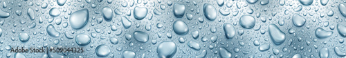 Banner of big and small realistic water drops in light blue colors, with seamless horizontal repetition