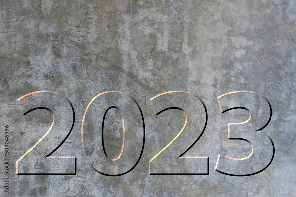 2023 on burnt cement wall texture with small cracks. new Year 2023 on burnt cement wall texture with small cracks. new Year