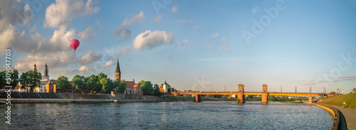 Bridge on river Nemunas in Kaunas city on sunny cloudy evening in summer.