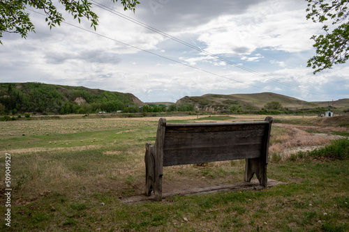 Old wooden church pew looking over the badlands.