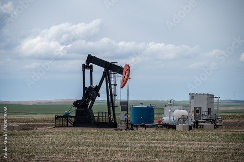 Pumpjacks working in the oil fields of Alberta on a spring day.