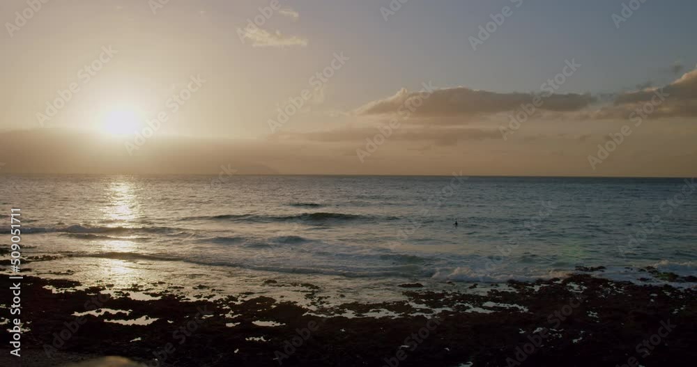 Ocean waves at sunset in Puerto de la Santiago, Tenerife Ocean waves at sunset in Puerto de la Santiago, Tenerife
