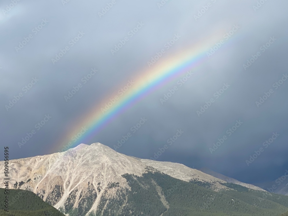 Rainbow over a mountain.