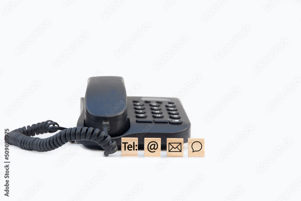 Telephone with wooden with contact icon for information hotline and online Telephone with wooden with contact icon for information hotline and online