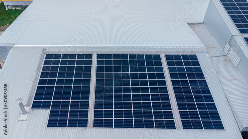 Solar power panels on the roof for green energy. Solar panels on factory roof photovoltaic solar panels absorb sunlight.