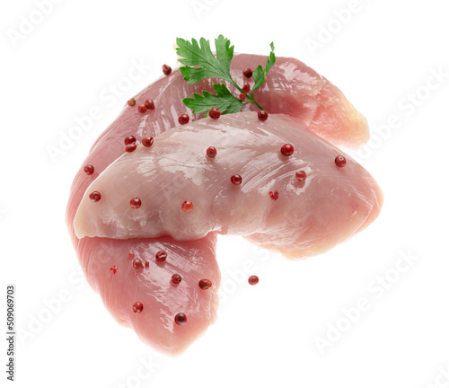 Turkey breast fillet with rosemary on a white plate.