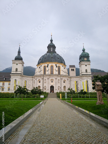 Ettal, Bavaria, Germany - August 25, 2019: Beautiful view of the Ettal Monastery, Ettal Abbey on a cloudy day. Vertical © lexosn