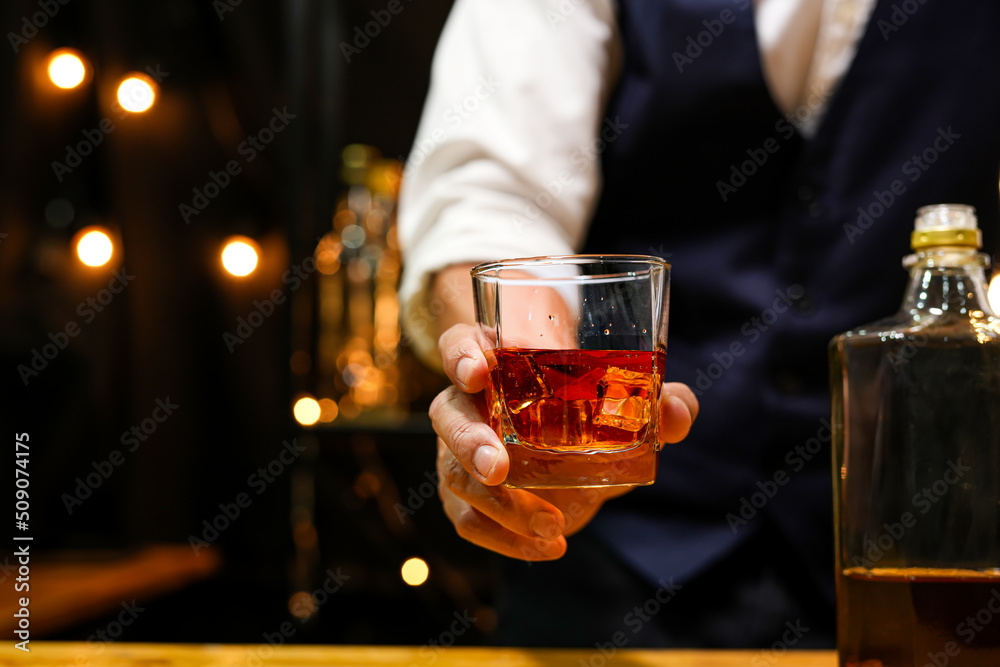 Bartender pouring Whiskey, on bar, Bartender pouring Whiskey, on bar,