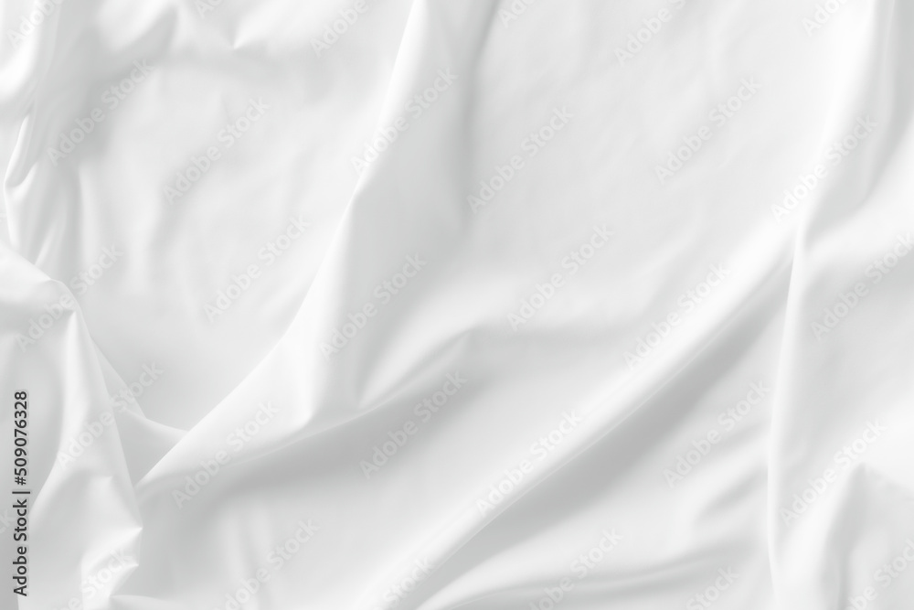 White fabric. luxurious white fabric texture background. Creases of satin, silk, and cotton.