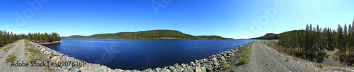 Panoramic view over lake in Sweden, seen from a gravel dam