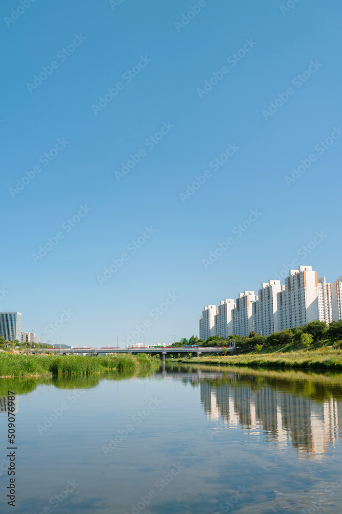 Anyangcheon stream park and apartment buildings in Seoul, Korea
