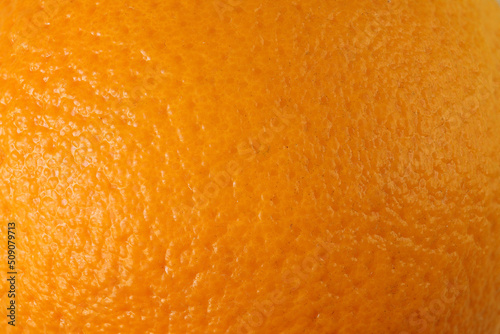 Texture of orange peel. Peel of orange fruit close-up.