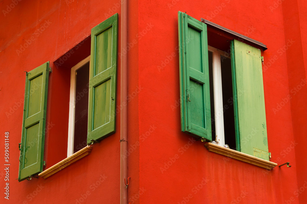 Colourful faceade and wooden window shutters, Bologna, Italy
