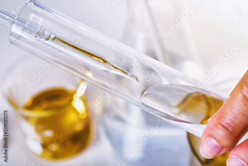 Obraz na płótnie Oil dropping, Chemical reagent mixing, Laboratory and science experiments, Formulating the chemical for medical research, Quality control of petroleum industry products concept w salonie